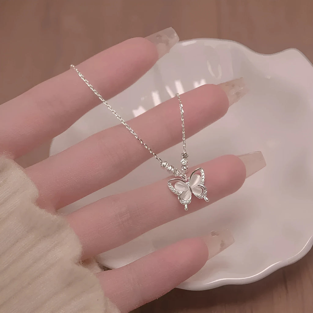 Square-set opal butterfly pendant on a cross chain, sterling silver women's adjustable necklace.