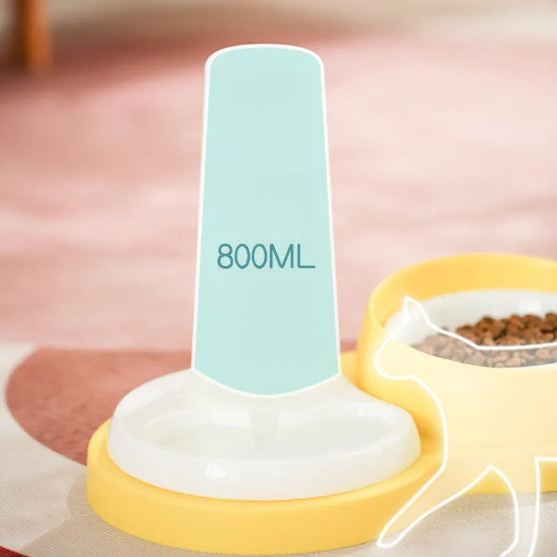 Grey and yellow dual ceramic pet feeding bowl with stainless steel insert and non-slip base.