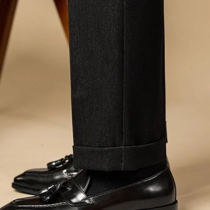 Men's genuine leather tassel loafers in black and brown colours showing polished uppers and rubber soles