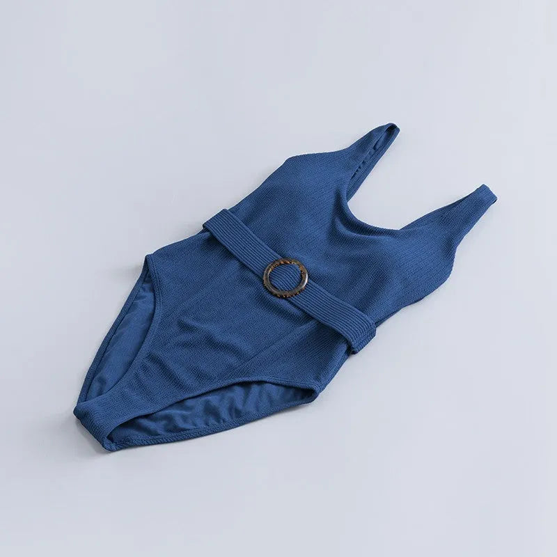 Navy blue women's one-piece swimsuit with chest padding and slim triangle design