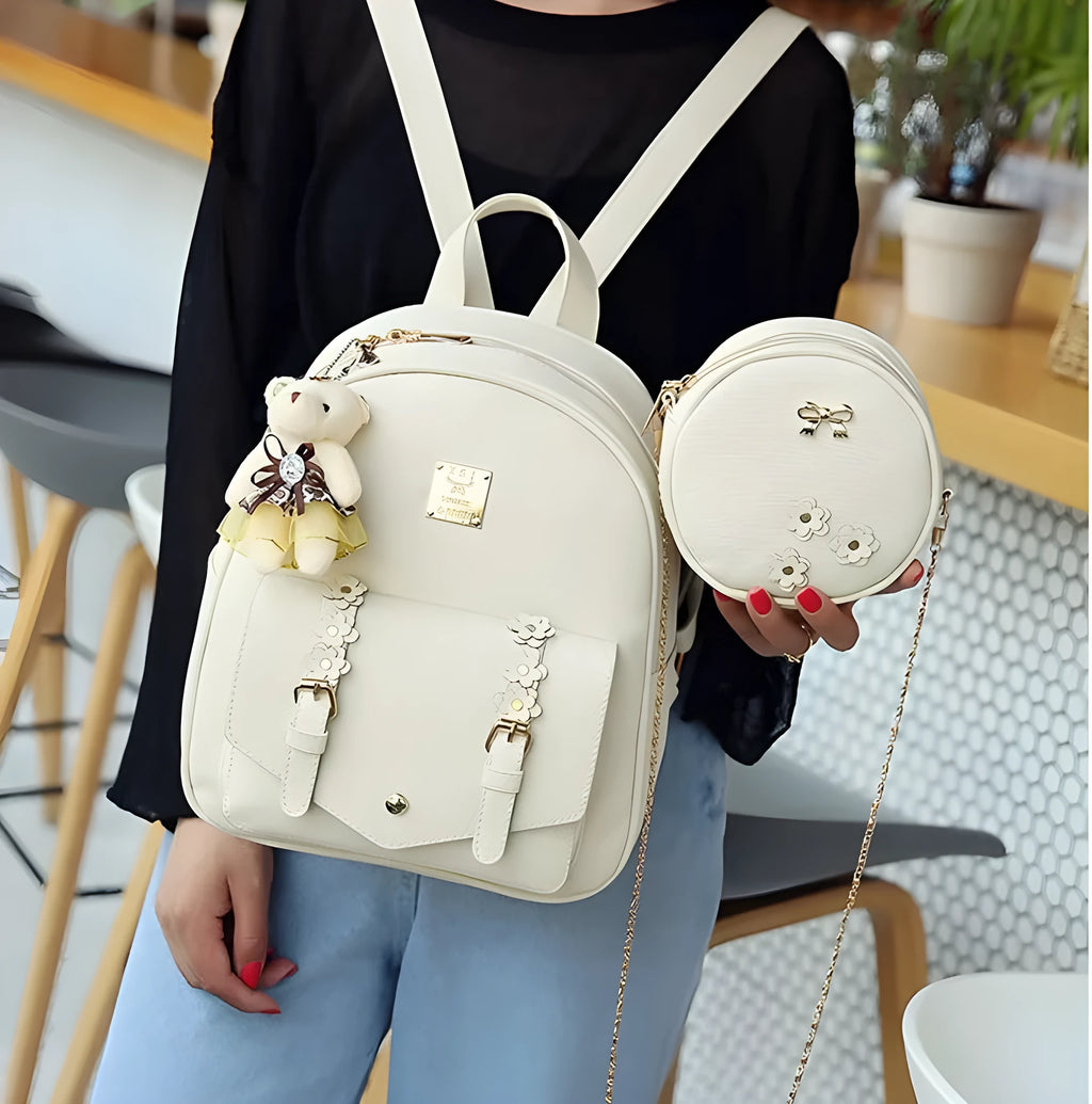 Women's three-piece PU leather bag set showing backpack, crossbody shoulder bag, and card purse in matching colour.