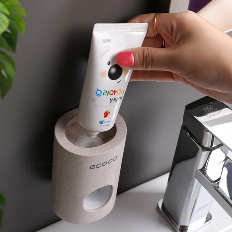 Two Ecoco single toothpaste dispensers in simple modern style, 15-18cm, on a bathroom countertop