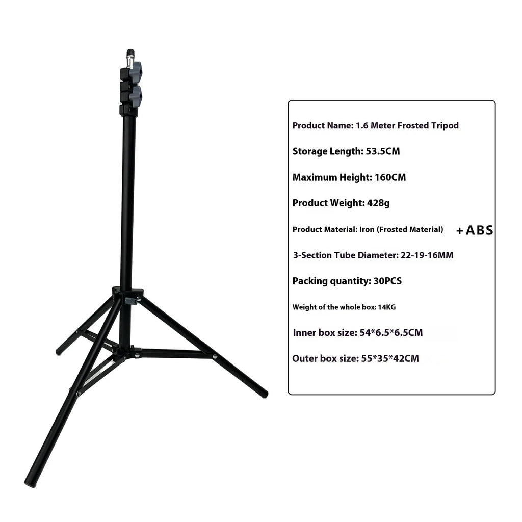 Tall black floor tripod stand holding a mobile phone extended to its full height on a wooden floor.
