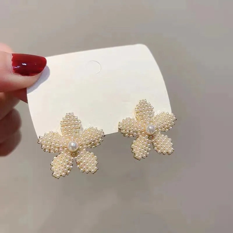 Pineapple and starfish motif drop earrings with pearl and artificial gemstone details on alloy metal
