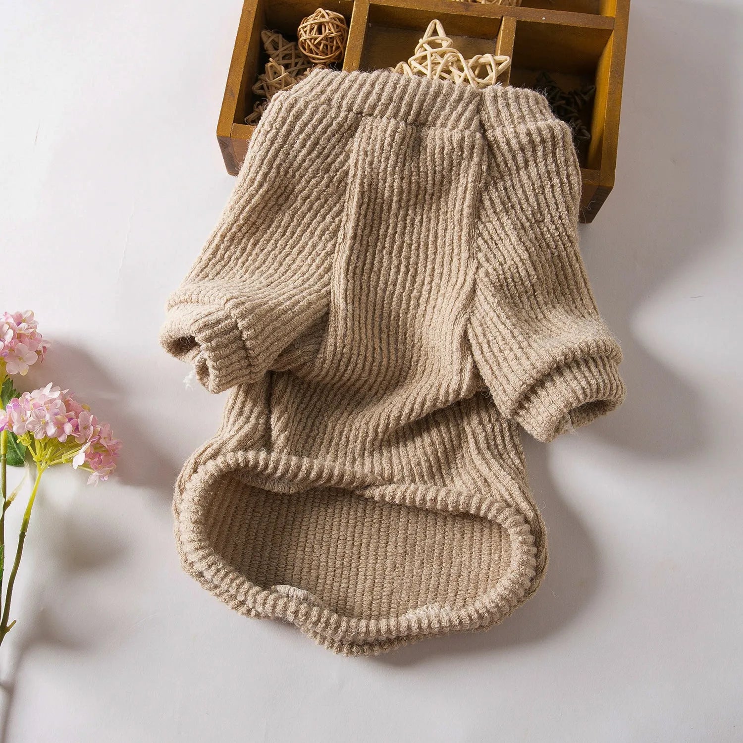 Brown cloth dog sweater pullover for small breeds on size chart showing XS to XL