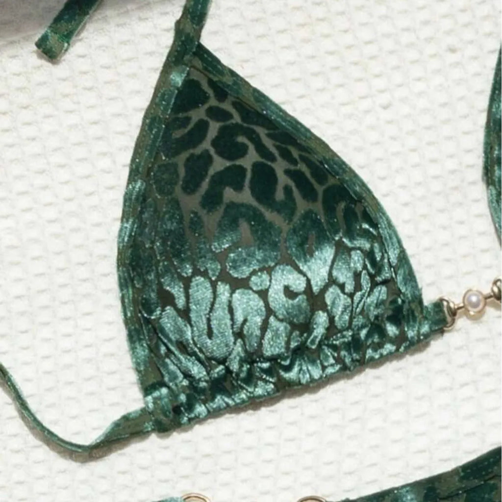 Blue leopard print women's bikini set on a mannequin, showing triangle top and briefs style.