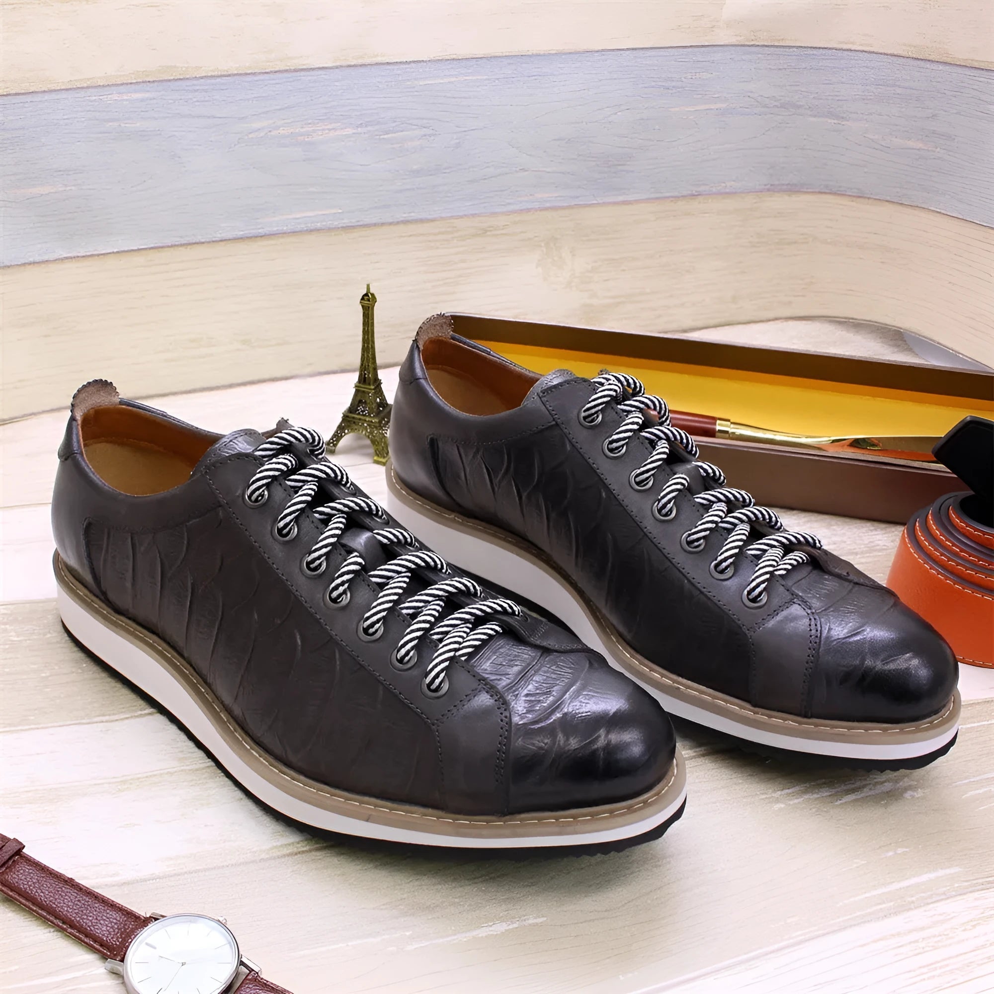 Men's low-top handmade lace-up shoes with an embossed pattern on the upper, shown in a choice of colours.