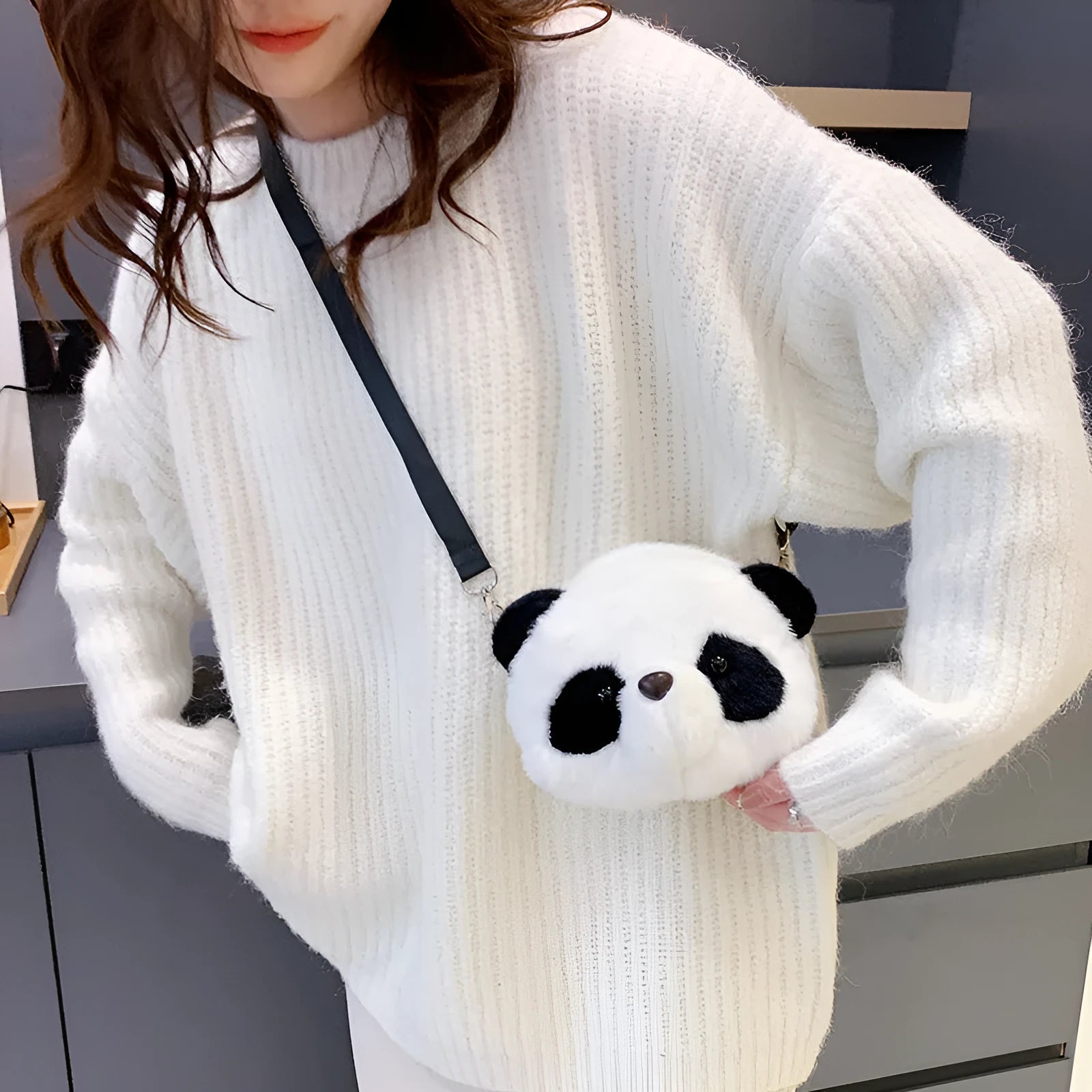 Plush cylindrical crossbody bag with panda head design measuring 18cm