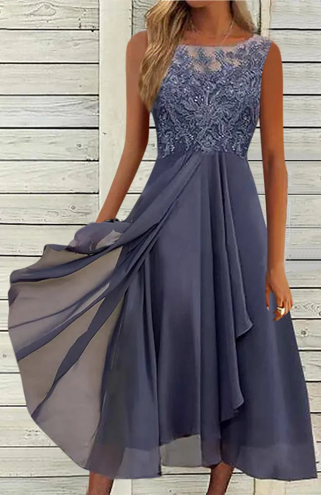 Women's sleeveless green chiffon dress with lace hollow-out detail and a mid-length flared skirt.