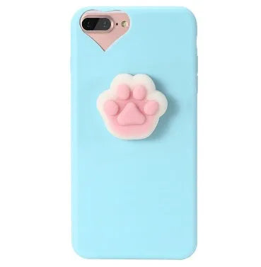 Soft silicone iPhone case with a raised 3D cartoon cat design, shown in pink.