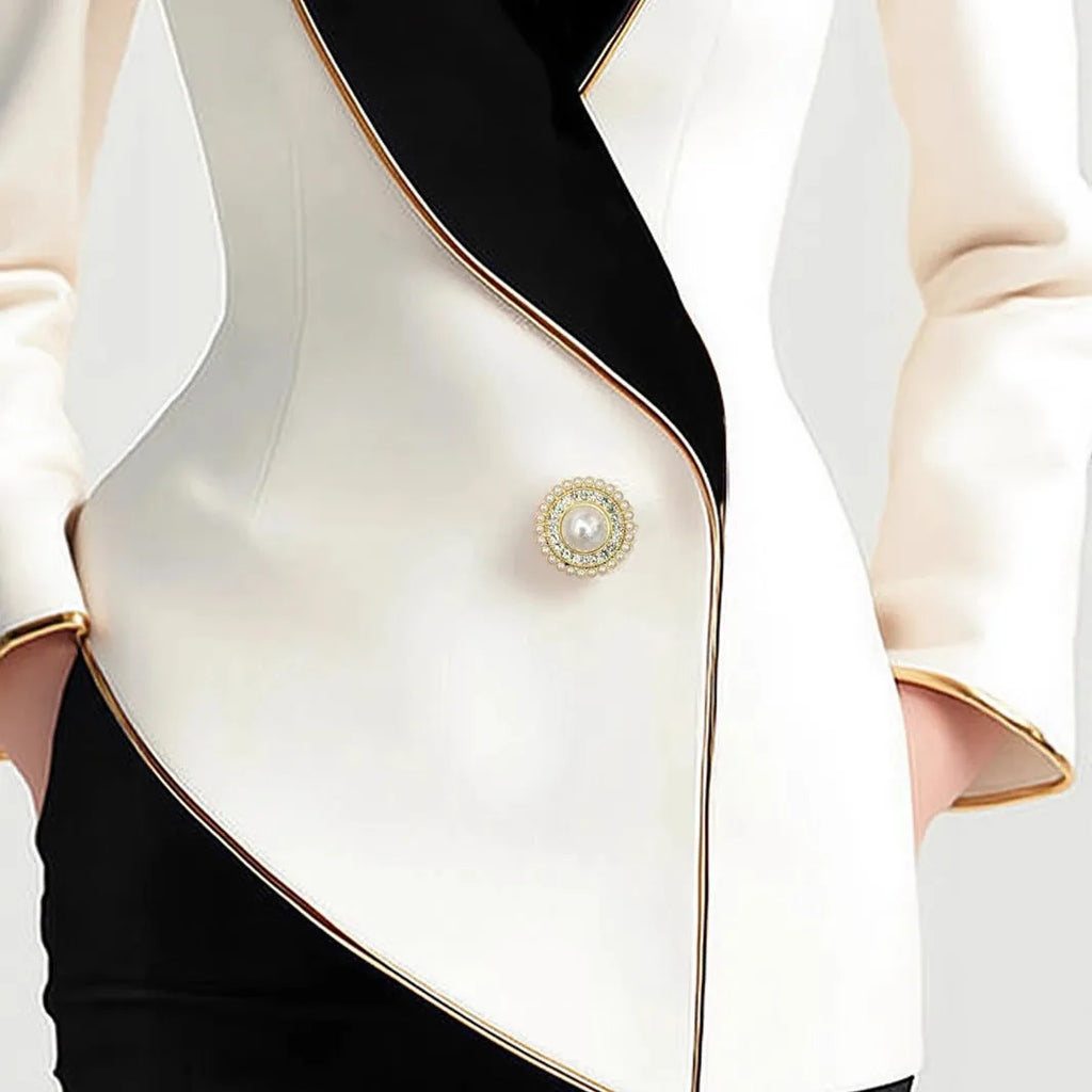 Women's irregular cut long sleeve coat with golden edge detailing and pearl buttons in milky white