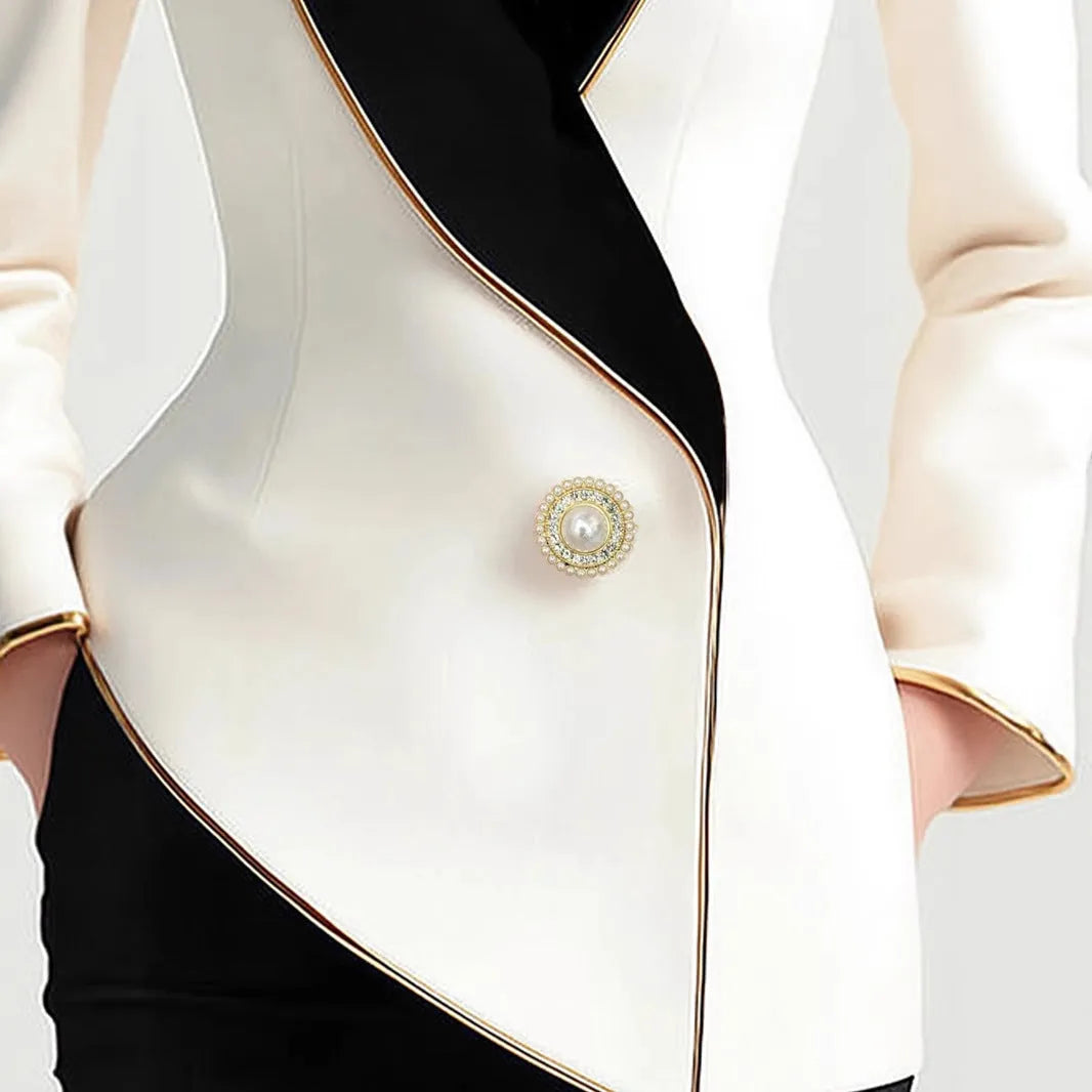 Women's irregular cut long sleeve coat with golden edge detailing and pearl buttons in milky white