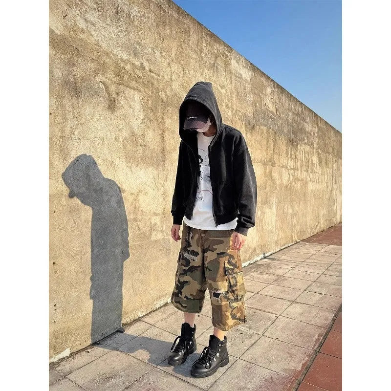 Men's camouflage cropped jeans with patchwork and ripped details in loose straight cut