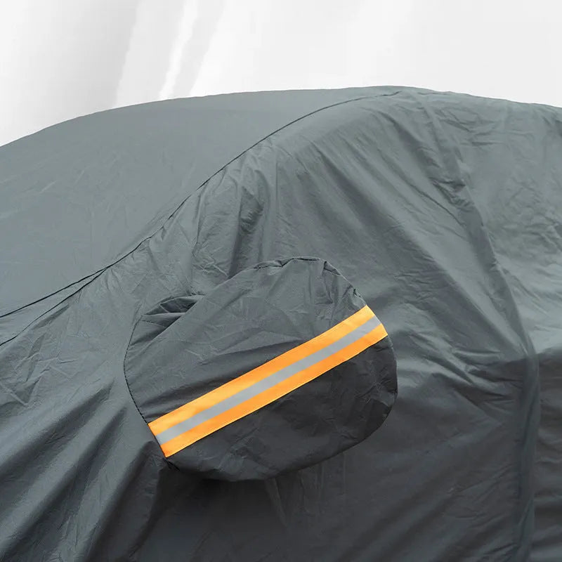 Grey Volkswagen car cover with PVC chemical fibre material shown in outdoor setting