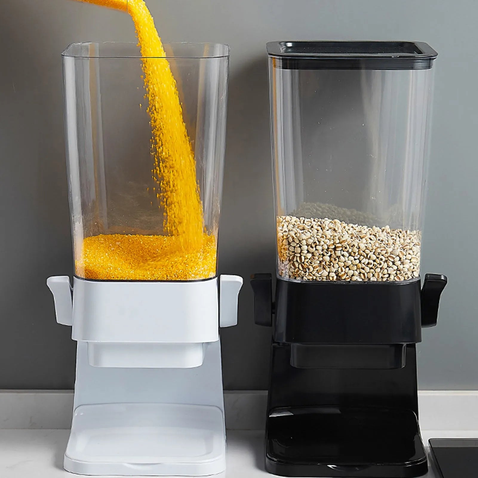 Countertop cereal dispenser in white with clear container and black lever showing chute opening
