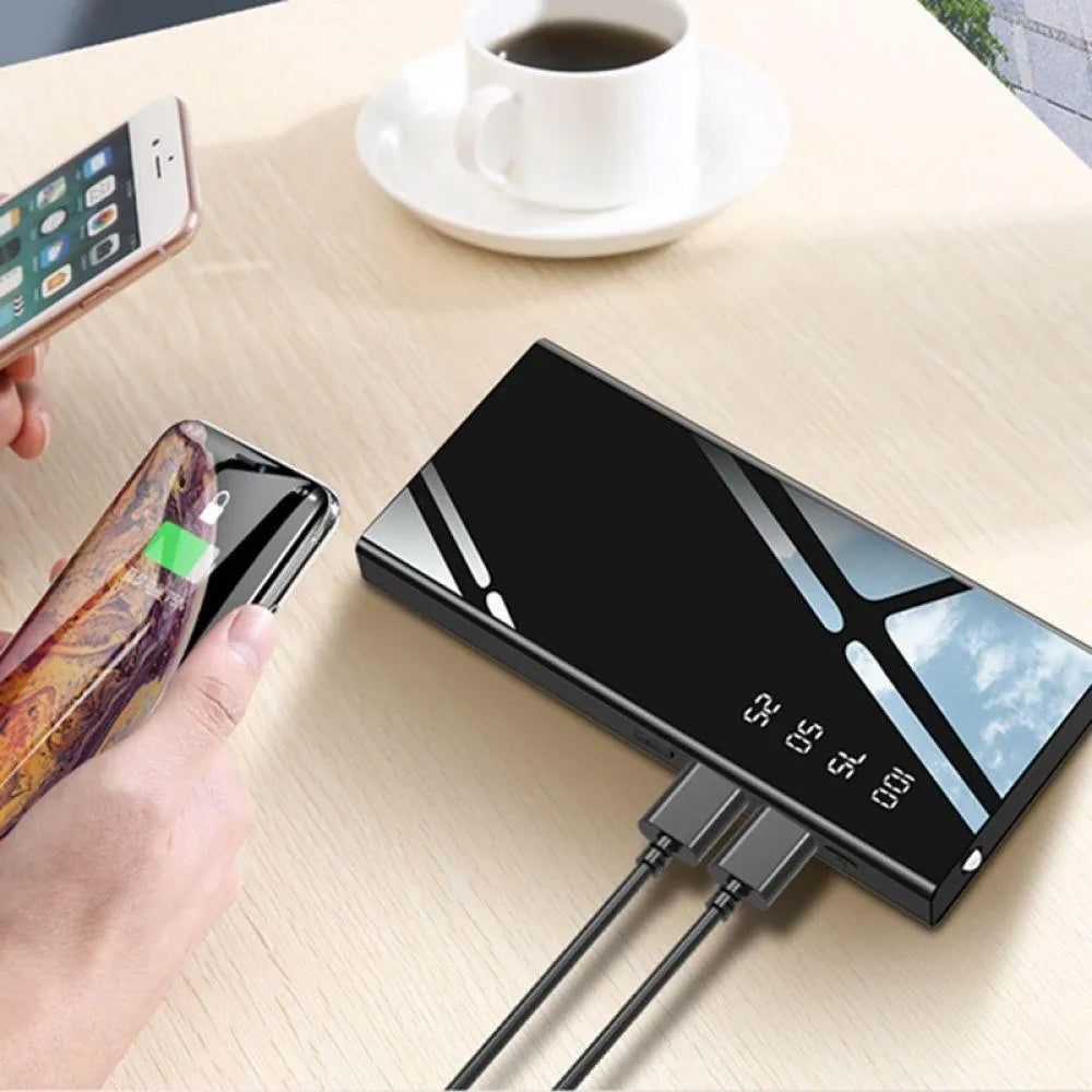20000mAh portable power bank with LCD screen, dual USB ports, and LED torch in black, red, or white.