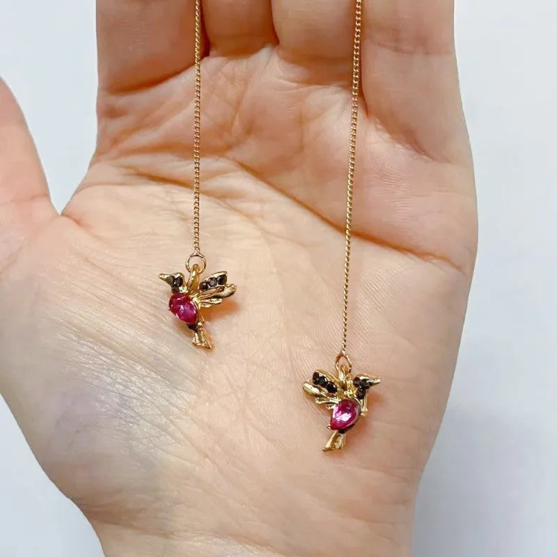 Personalised bird hanging earrings with zirconium wing detail and zodiac animal modelling in long drop style