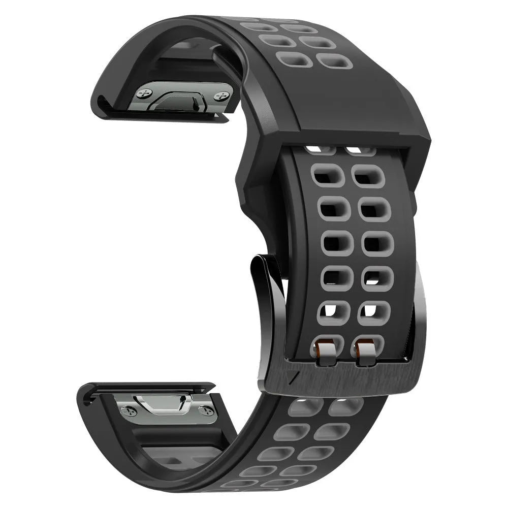 Quick release two-tone silicone watch strap in black and orange with pin buckle.