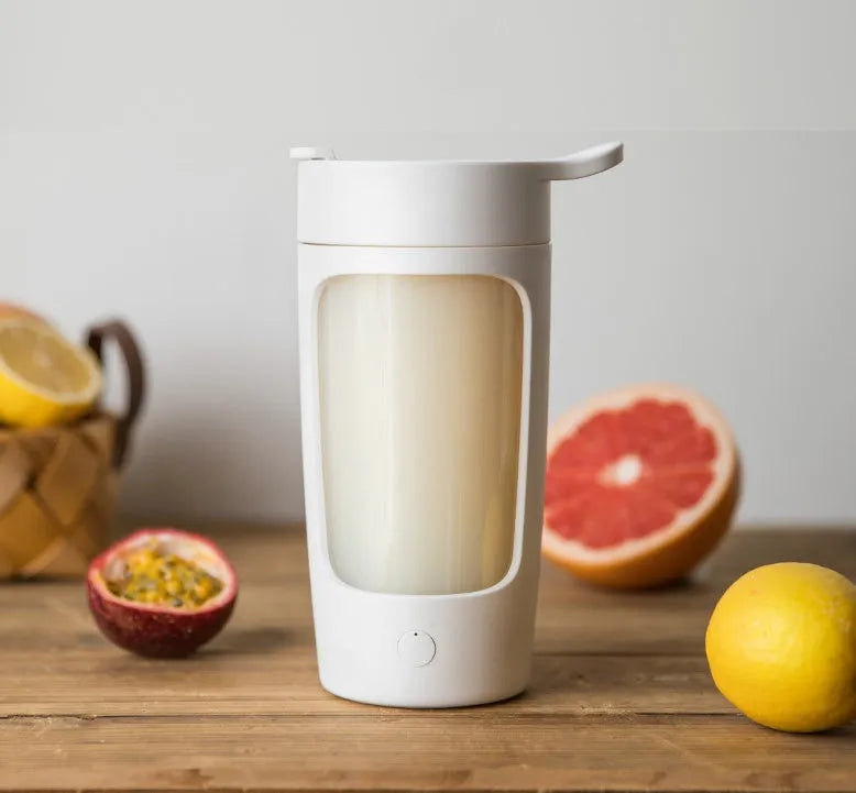 Portable juice blender cup in black, blue, pink, or white with 650ml capacity and compact design