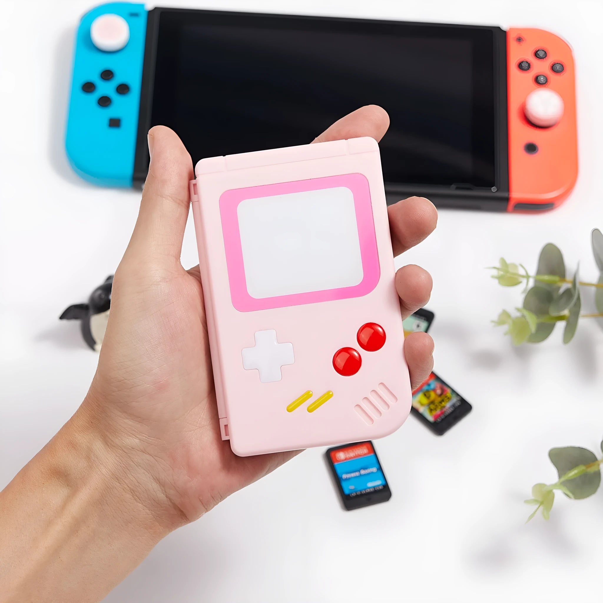 Slim white Nintendo SWITCH game card storage box for OLED and LITE models on a table.