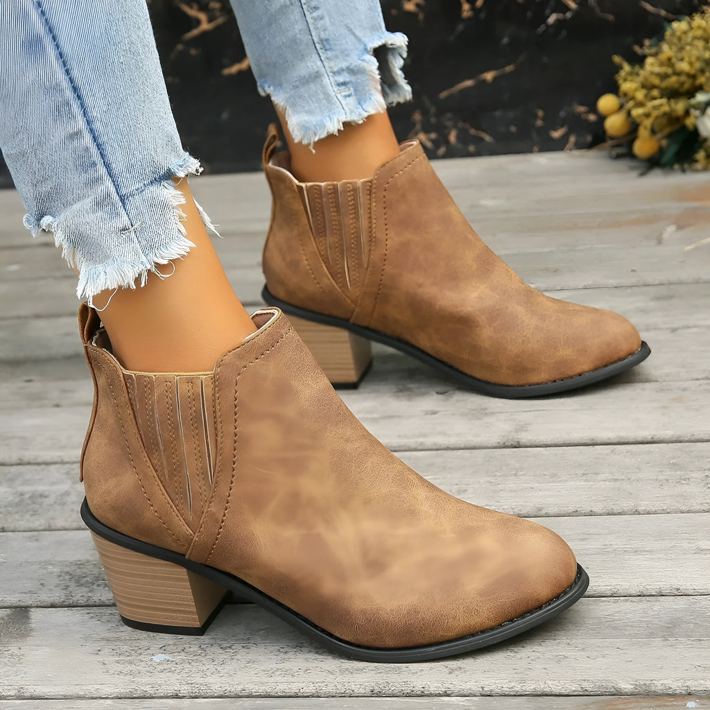 Women's black slip-on ankle boots with pointed toe and thick square heel
