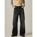 Black loose fit straight leg retro jeans on a hanger, showing zipper fly and relaxed silhouette.