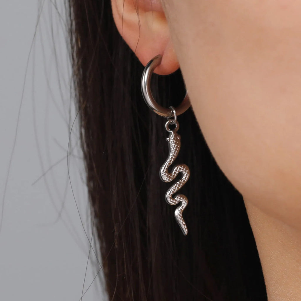 Vintage snake-shaped stainless steel earrings with gold plating in an ear clip design.