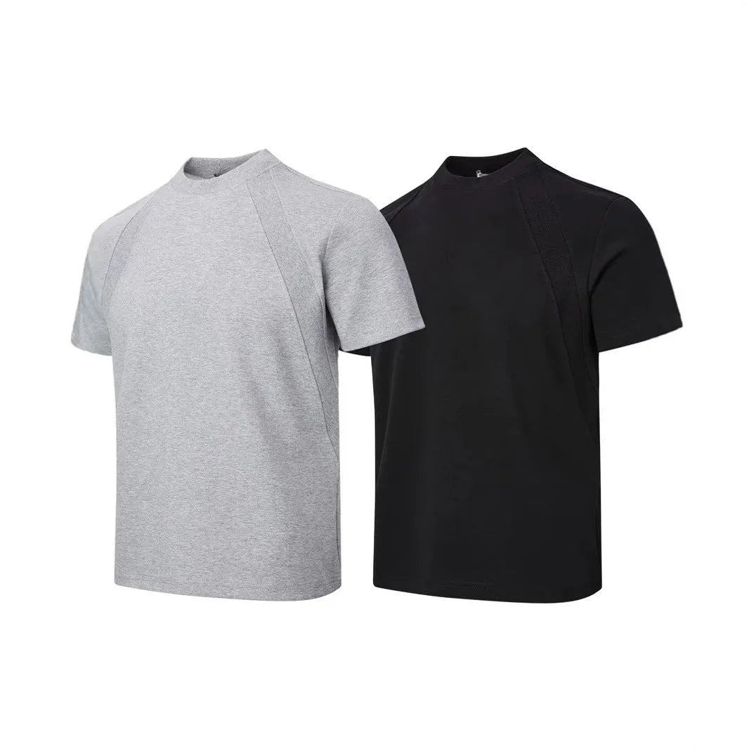 Black loose fit short sleeve top with air layer stitching detail on a hanger