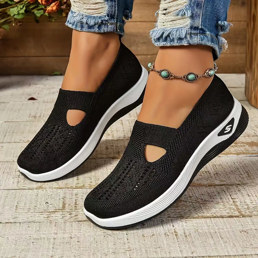 Women's solid colour mesh T-strap casual shoes with flat heel and round toe.