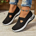 Women's solid colour mesh T-strap casual shoes with flat heel and round toe.