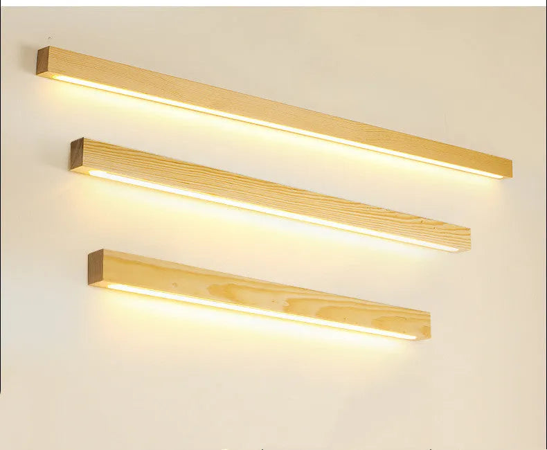 Walnut-coloured wood and acrylic linear LED strip wall lamp in a modern minimalist style.