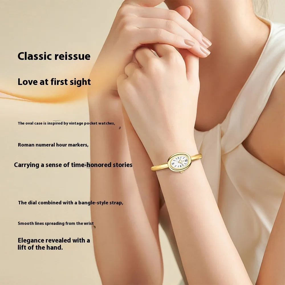 Women's oval retro quartz watch in gold colour with spiral pattern on 8mm slim case