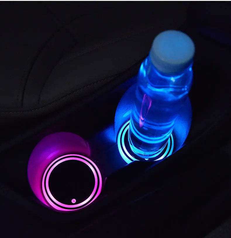 Colourful LED light-up coaster for car cup holder showing seven changeable colours and USB cable.