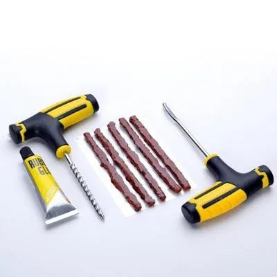 8 piece vacuum tyre repair tool set showing tyre repair probe, rubber strips, glue, and insertion tools