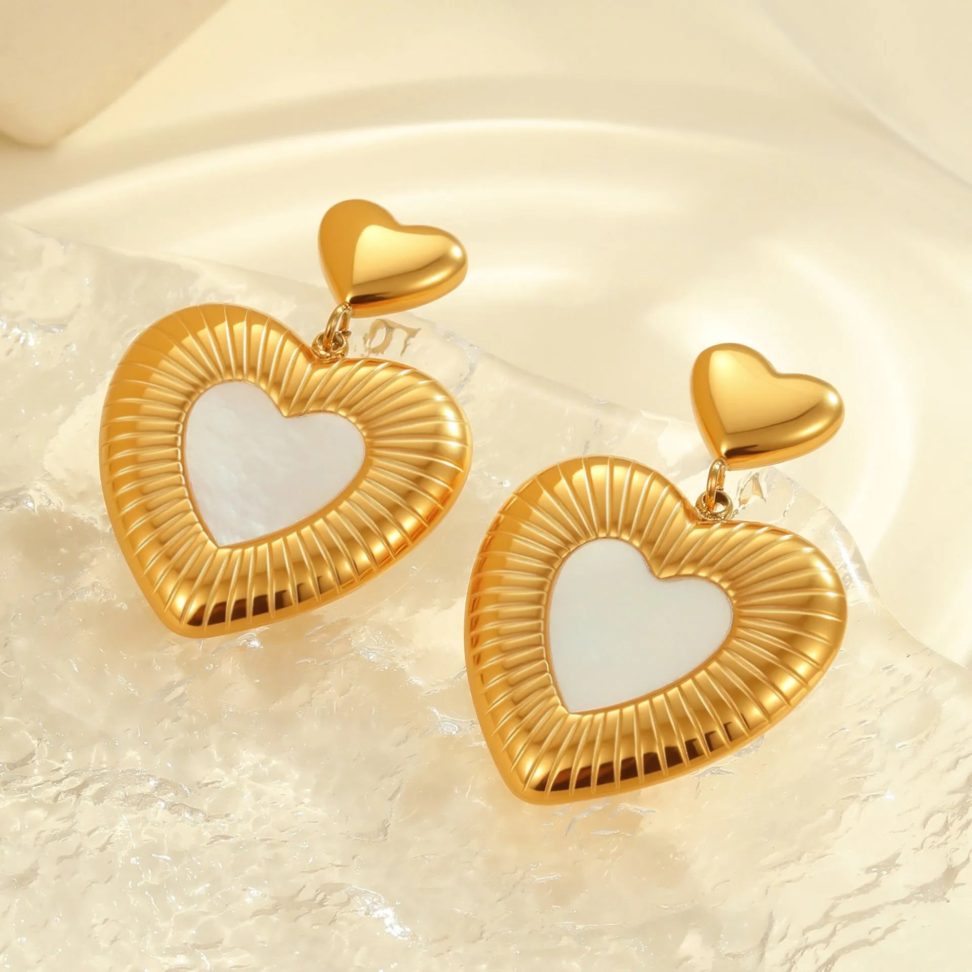 Heart shaped stainless steel earrings with white fritillary pattern and 18K gold electroplated finish for women