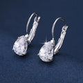 Drop-shaped copper fashion earrings with gemstone inlays in gold or platinum colour finishes