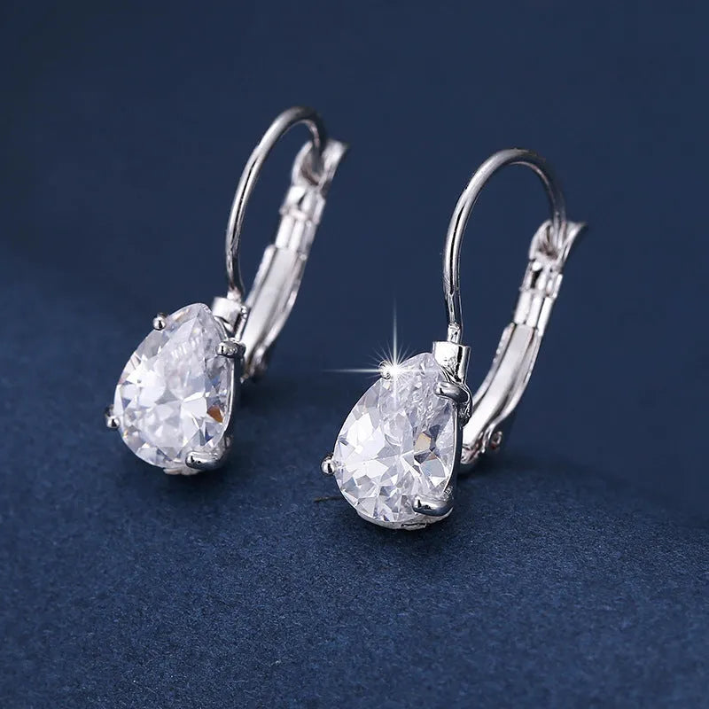 Drop-shaped copper fashion earrings with gemstone inlays in gold or platinum colour finishes