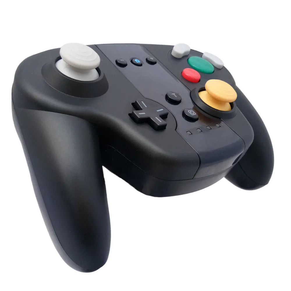 Black wireless gamepad for Nintendo Switch and PC with NFC reader near thumbsticks.