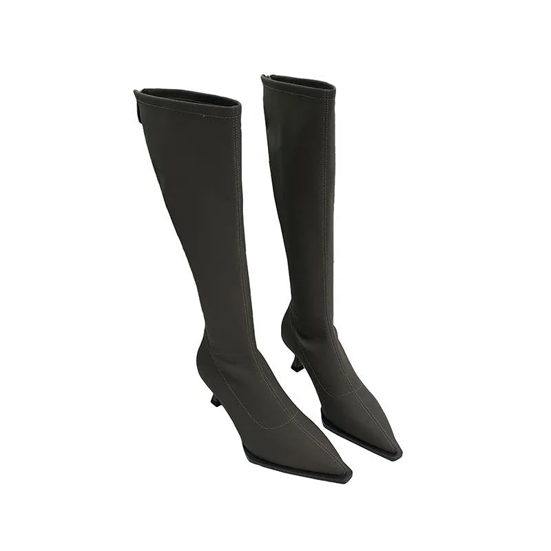 Black women's pointed toe below knee boots with a stiletto heel and a back zip fastener.