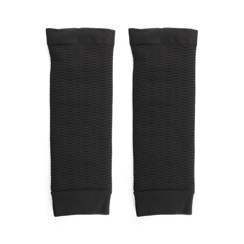 Pair of women's black shaping arm sleeves made from nylon fabric for upper arms.