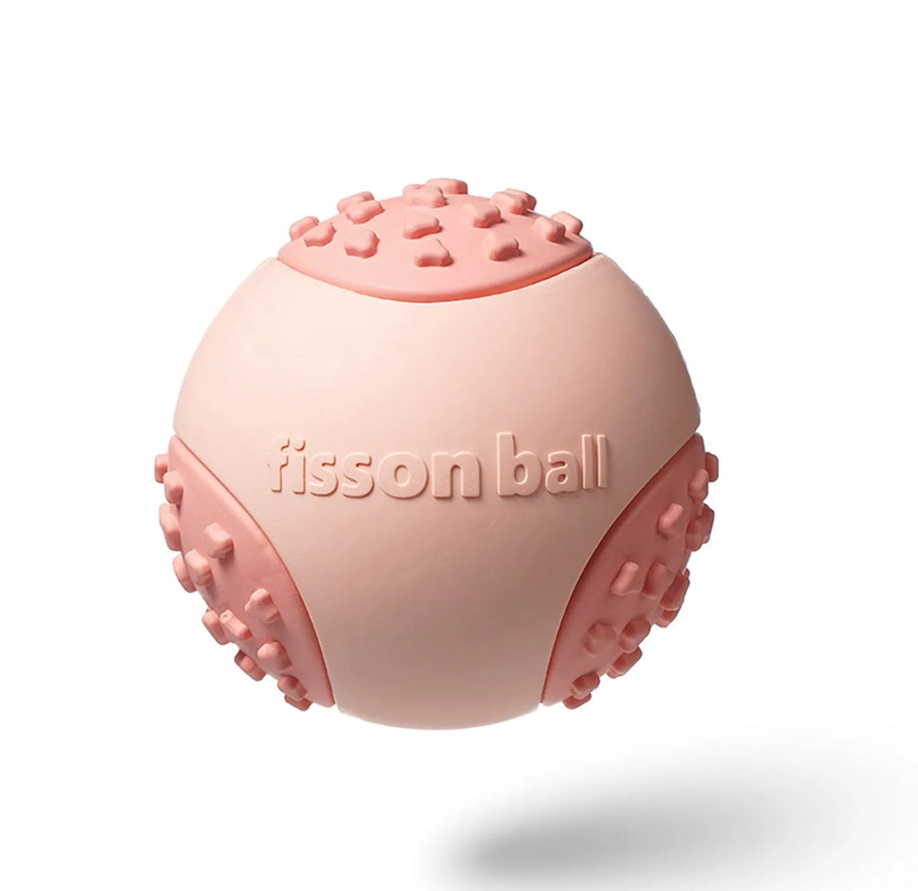 Green and pink rolling ball dog toy with 64mm diameter for interactive motion play