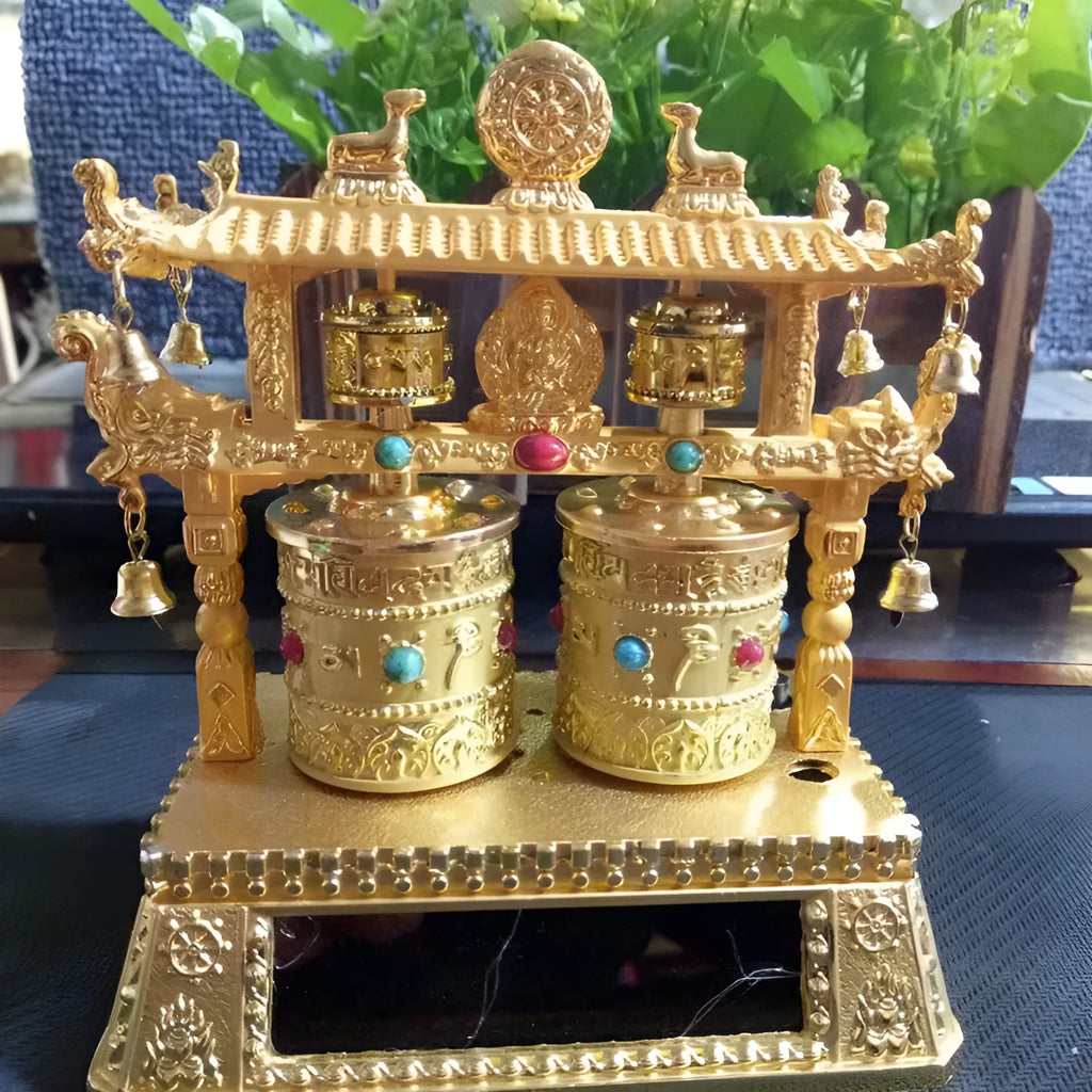 Traditional Chinese alloy prayer wheel car decoration on a dashboard