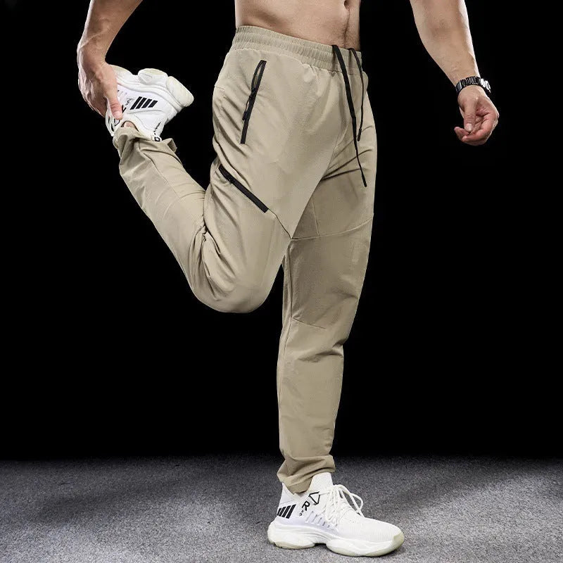 Men's black waterproof quick-drying workout pants with mid waist design for sports and fitness
