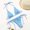 Women's polka dot print split bikini swimsuit in briefs and triangle styles on a mannequin