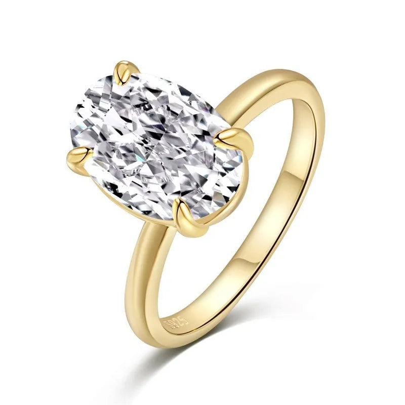 Oval women's ring in silver with four-claw setting holding a hand-cut gem.