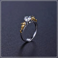 Copper crown fashion ring with black gold crystal centrepiece shown in individual packaging