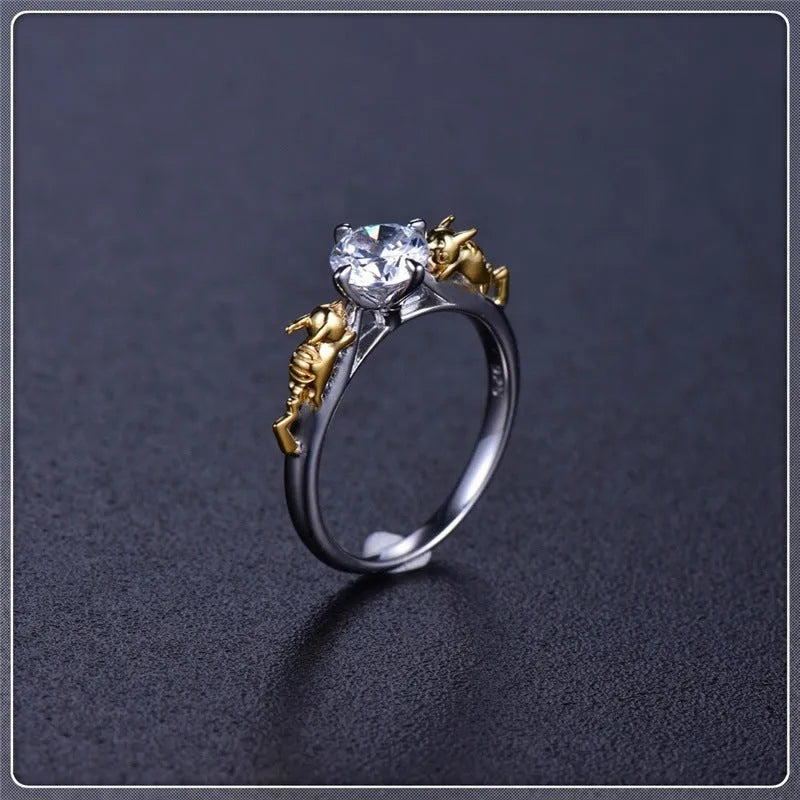 Copper crown fashion ring with black gold crystal centrepiece shown in individual packaging