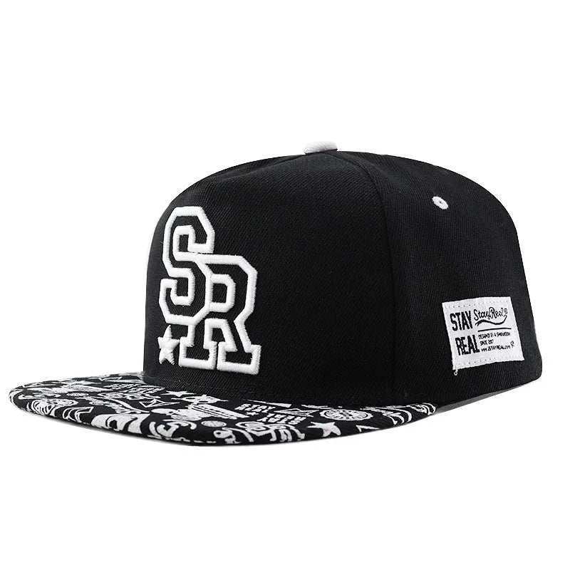 Cotton baseball hat with front letter embroidery in black colour, showing adjustable strap and dome crown.