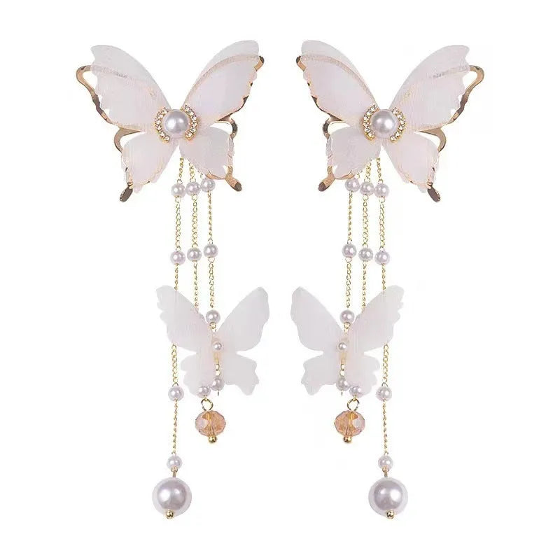 Women's white butterfly earrings with tassel design, lace pattern, and pearl rhinestone accents on electroplated copper alloy