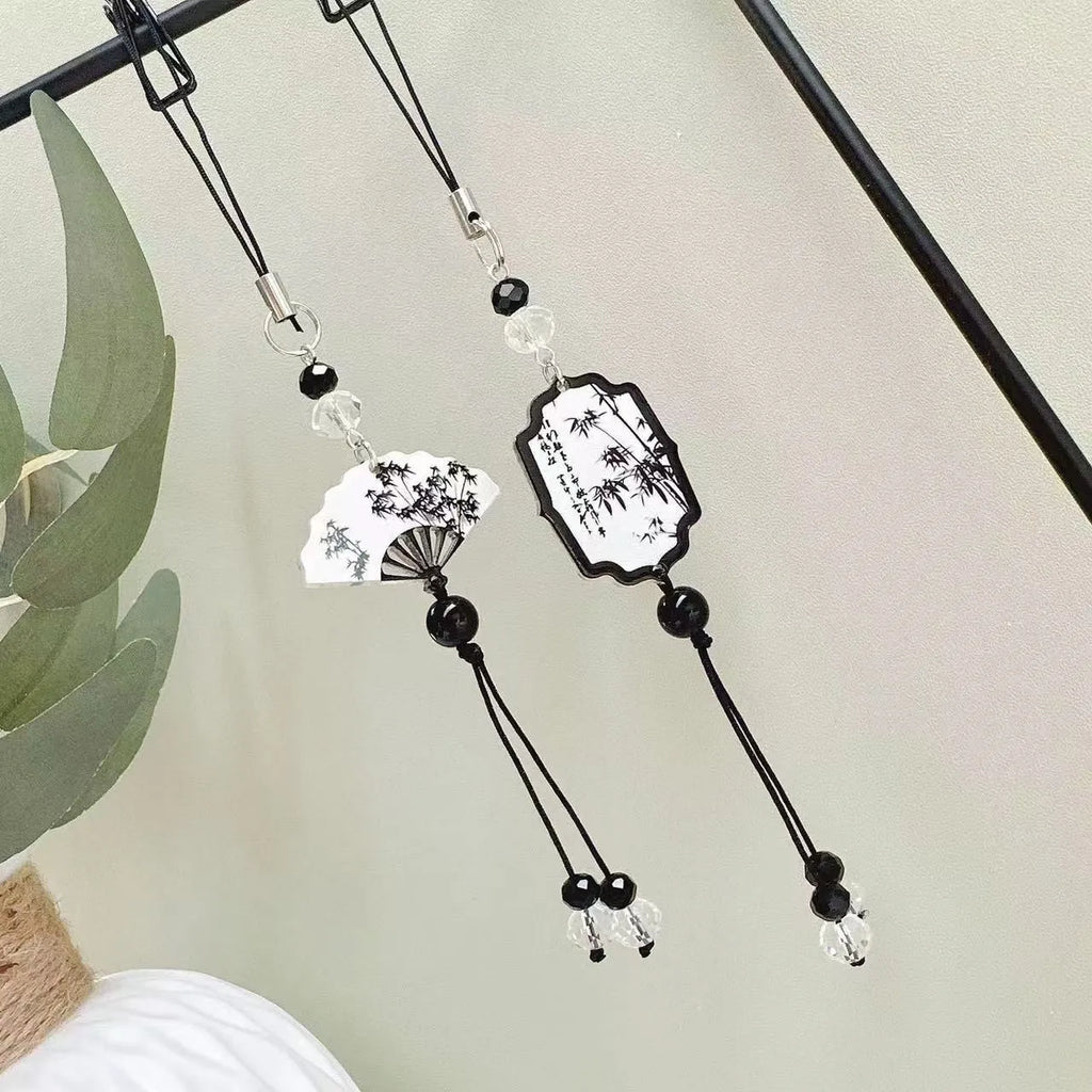 Guofeng Chinese style bead pendant keychain with detailed plant and flower pattern in a glossy finish.